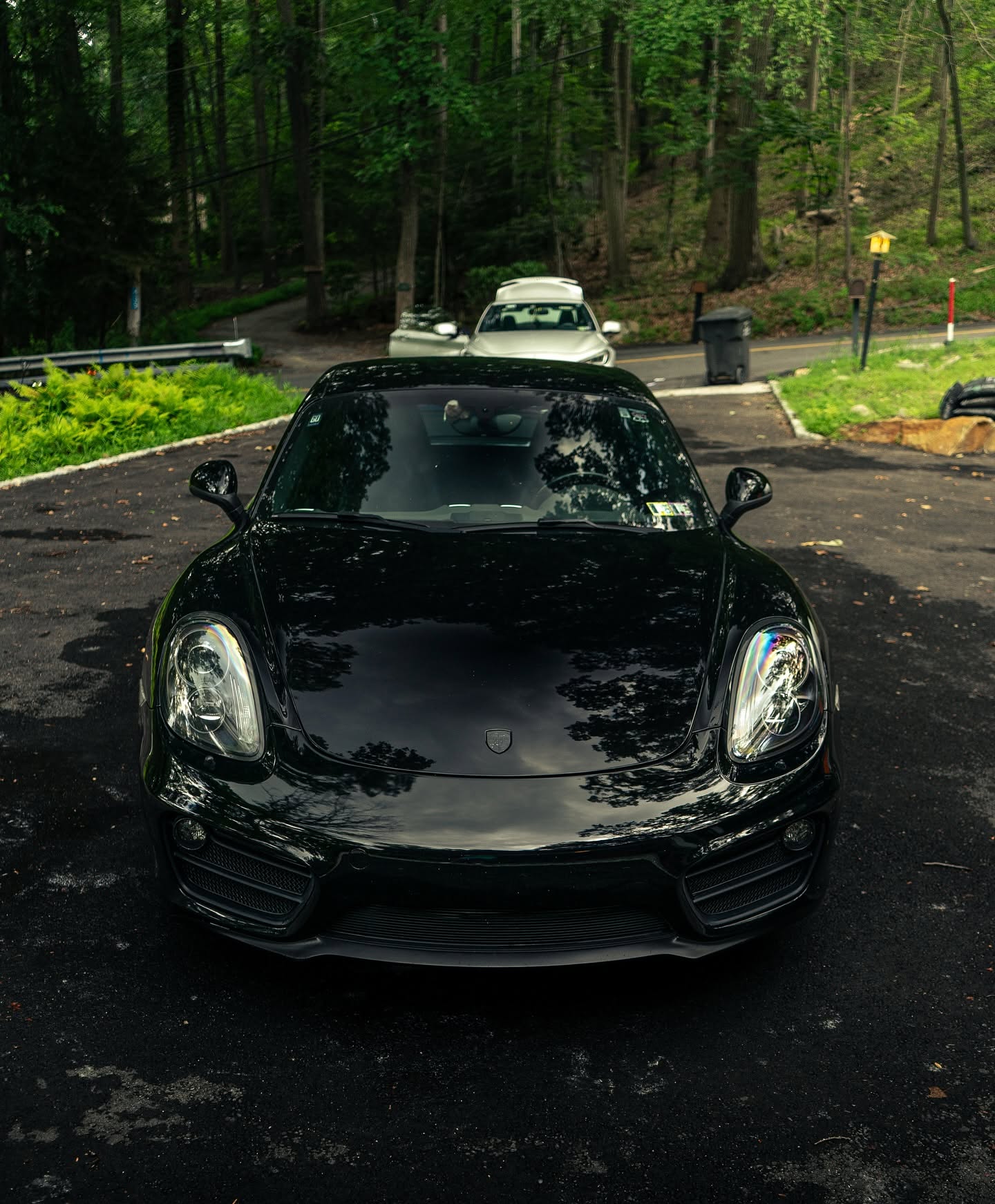 Black Porsche Cayman with a deep gloss finish after detailing